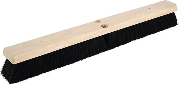 Wooden push broom head with black bristles.