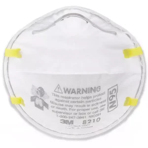 3M 8210 N95 respirator mask with yellow straps and printed warning label.